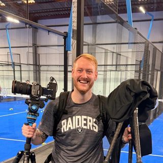 Adam Fearnhead from Fearny Films with his camera and tripod at a padel club