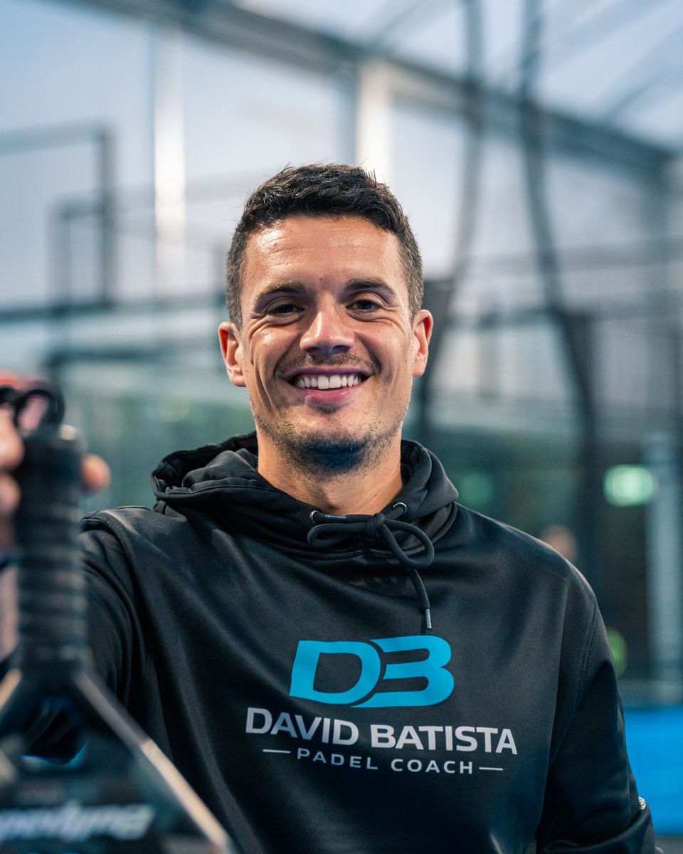Portrait of a padel coach in branded kit, photographed for his social media